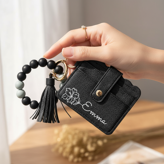 Woman holding black wallet