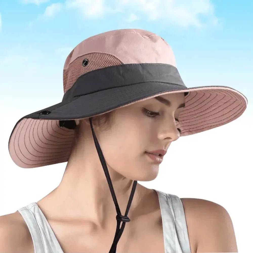 Woman wearing a stylish pink and gray sun hat with chin strap, sky background, Ivorynn fashion