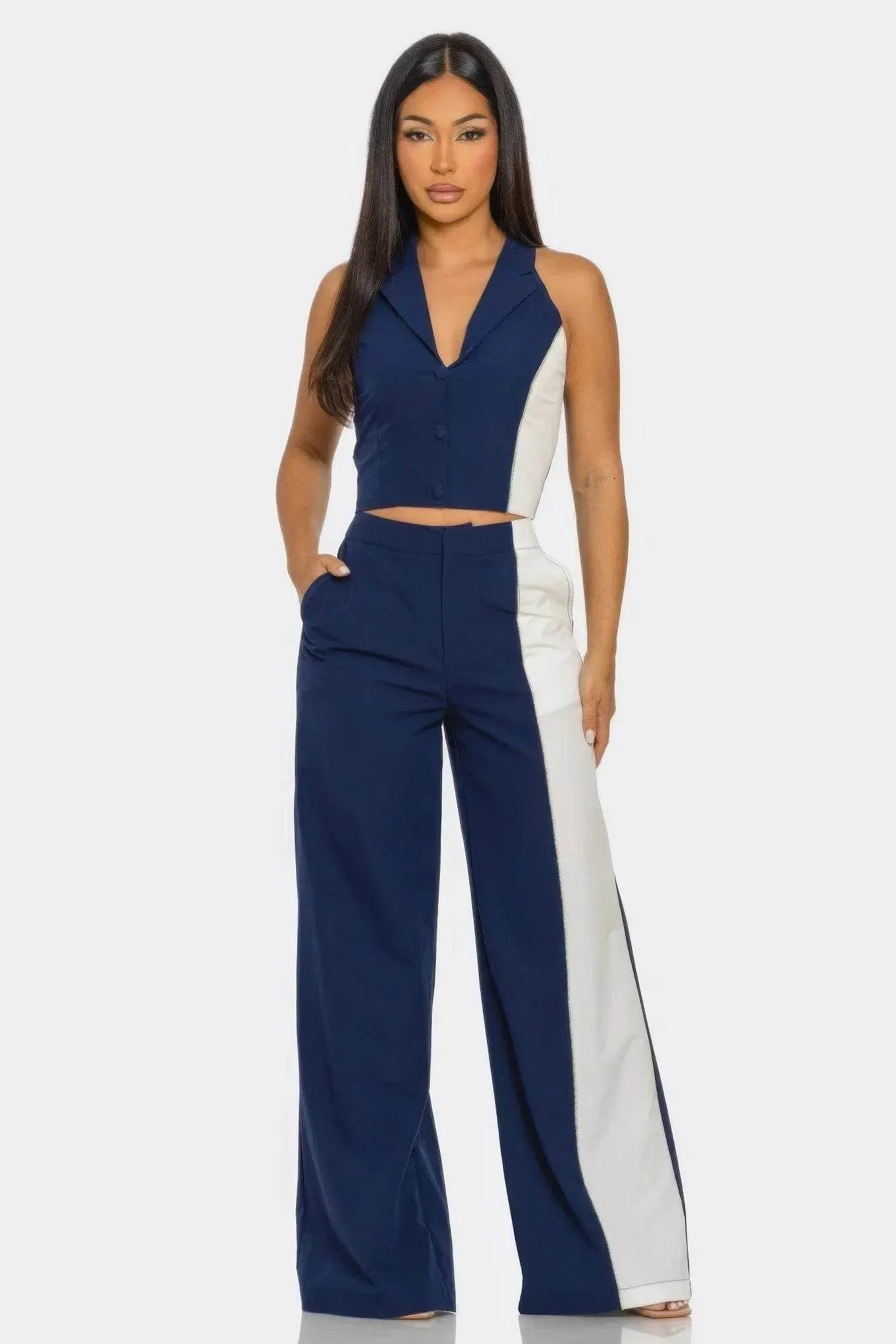 Woman modeling navy blue and white sleeveless pantsuit, modern women's fashion Ivorynn