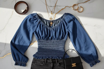 توب جينز أزرق مع إكسسوارات ذهبية