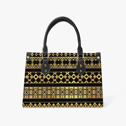 Geometric gold and black tote bag with black handles, modern fashion accessory on white background