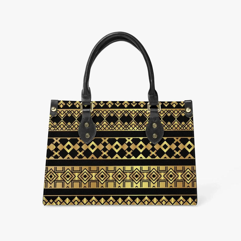 Geometric gold and black tote bag with black handles, modern fashion accessory on white background