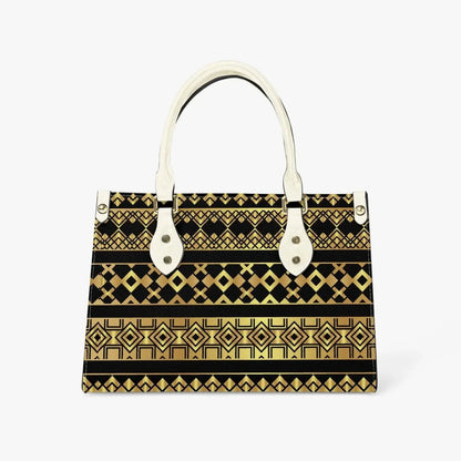 Ivorynn tote bag with black and gold geometric pattern and ivory handles on white background