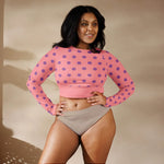 Woman wearing apricot long sleeve crop top with purple polka dots by Ivorynn