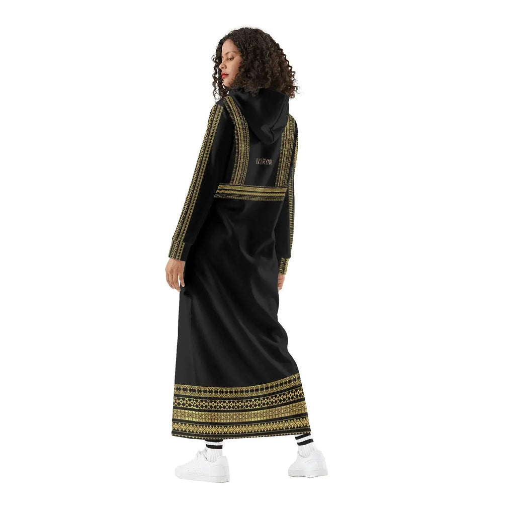 Woman modeling IVORYNN elegant black casual long hoodie dress with gold trim, white sneakers