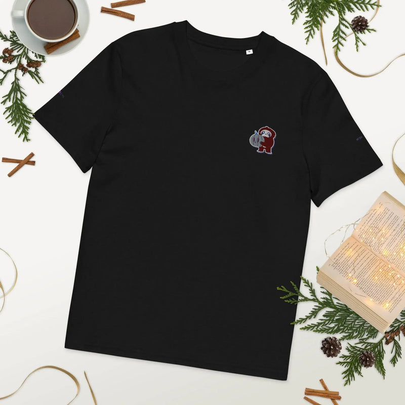 Black organic cotton t-shirt with embroidered red monkey, flat lay with festive decor, Ivorynn
