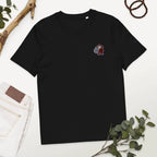 Black organic cotton t-shirt with embroidered cartoon monkey, styled with jeans and greenery, Ivorynn fashion