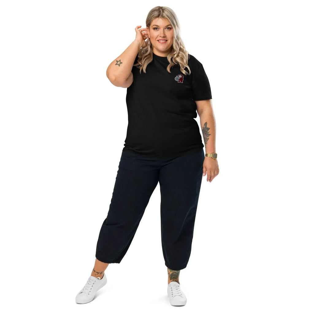 Woman modeling black embroidered t-shirt and navy pants from Ivorynn, casual fashion look