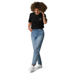 Woman wearing black embroidered monkey organic cotton t-shirt and blue jeans from Ivorynn