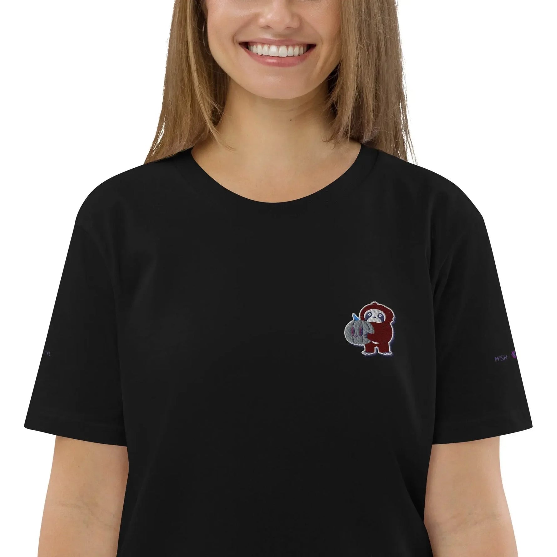 Woman wearing IVORYNN organic cotton t-shirt with embroidered little monkey design