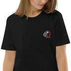 Woman wearing a black t-shirt from IVORYNN with a small embroidered cartoon character on chest