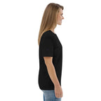 Woman in black t-shirt and jeans, side view, on plain white background, Ivorynn fashion