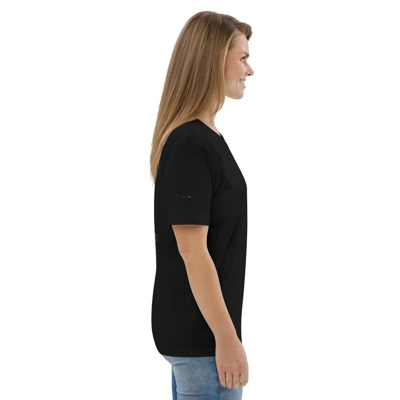 Woman in black t-shirt and jeans, side view, on plain white background, Ivorynn fashion