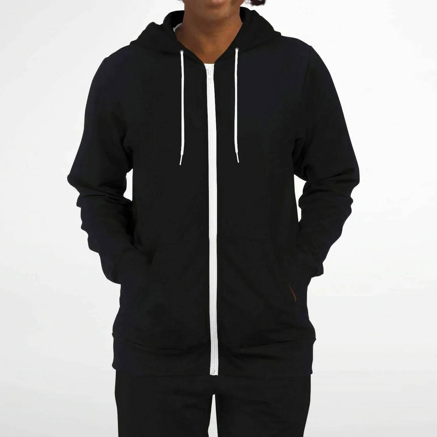 Woman wearing black zip-up hoodie with white drawstrings from IVORYNN fashion collection