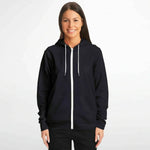 Woman wearing black athletic zip-up hoodie with white accents, Ivorynn fashion apparel