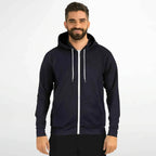 Man wearing a black zip-up hoodie with white drawstrings, modern casual fashion at Ivorynn.