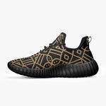 Men’s black knit mesh sneaker with gold geometric pattern, black sole, Ivorynn luxury shoes.