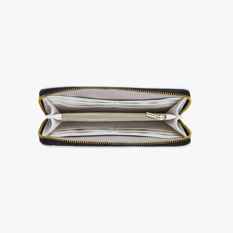 Black and ivory zippered wallet with gold accents and multiple interior compartments from Ivorynn