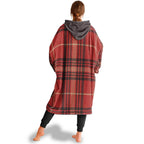Woman in cozy plaid oversized hoodie with dark hood, modeled from the back at Ivorynn