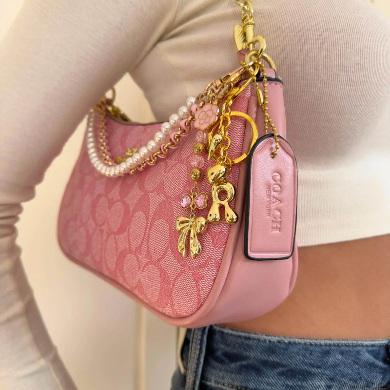 Vintage Luxury Pink Handbag with Pearls and Charms - IVORYNN