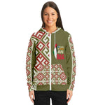 Woman wearing olive zip-up hoodie with red and white geometric patterns from Ivorynn