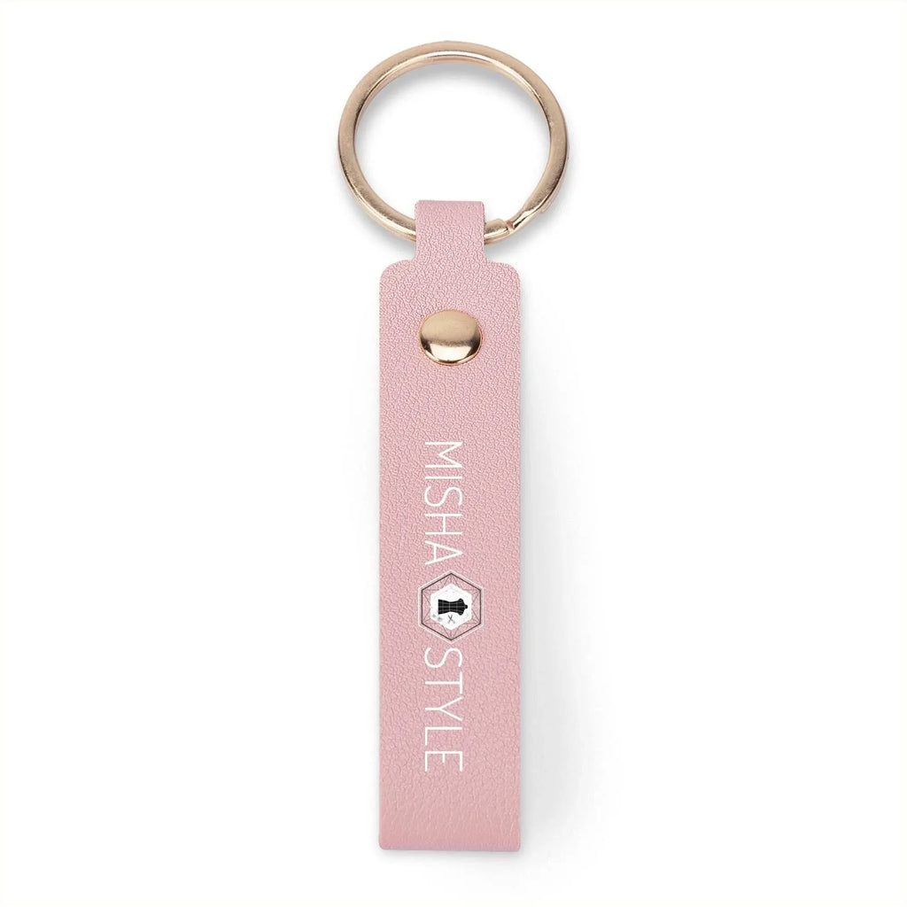 Pink faux leather keychain with gold ring, branded MISHA STYLE, modern and stylish accessory.