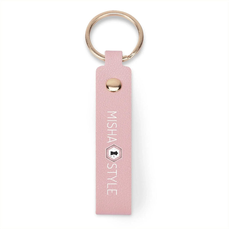 Pink faux leather keychain with gold ring, branded MISHA STYLE, modern and stylish accessory.