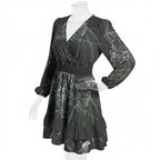 Black long-sleeve V-neck dress with white abstract print on mannequin, Ivorynn fashion apparel