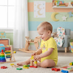 Baby boy in yellow onesie - side view
