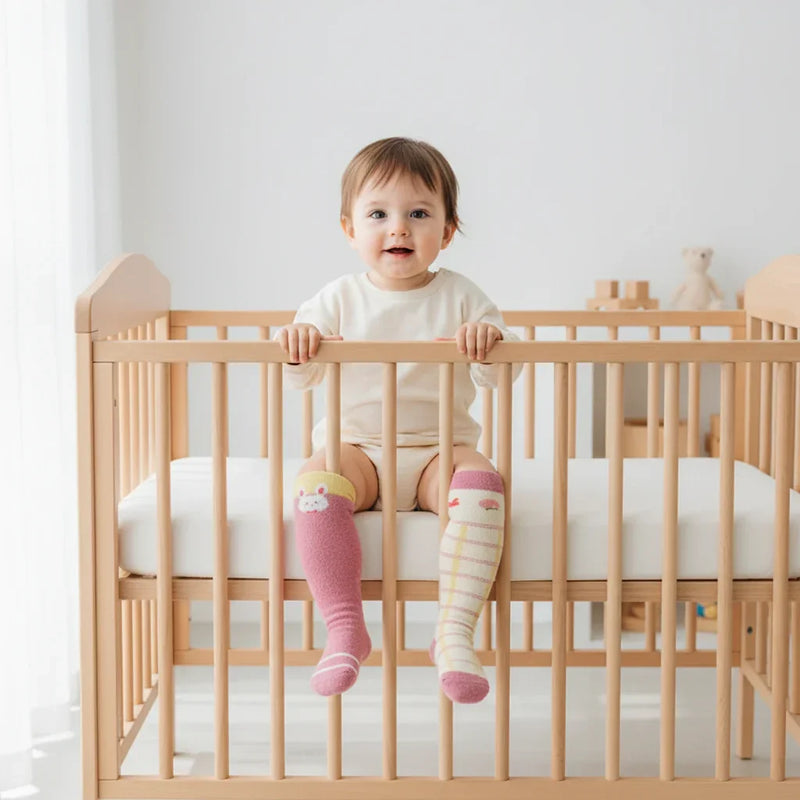 Baby girl front view in crib
