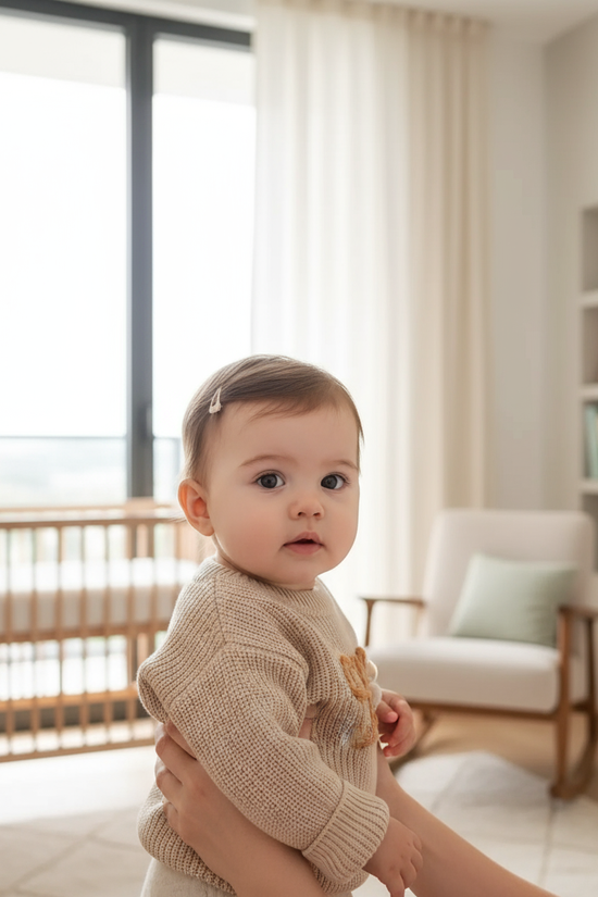 Baby girl in nursery - near window