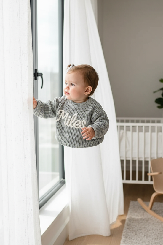 Baby girl in nursery - near window