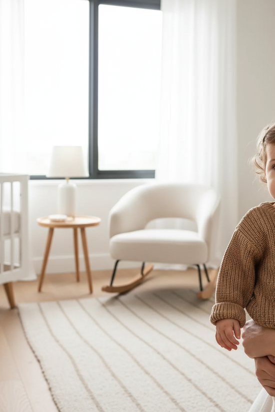 Baby girl in nursery - near window
