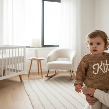 Baby girl in nursery - near window