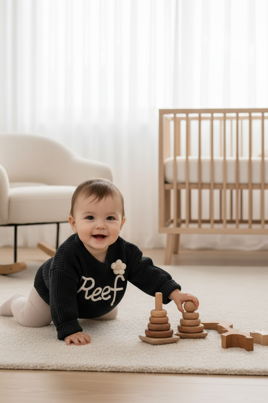 Baby girl in nursery - playing