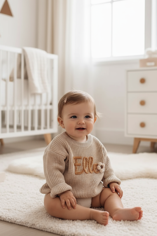 Baby girl in nursery - sitting
