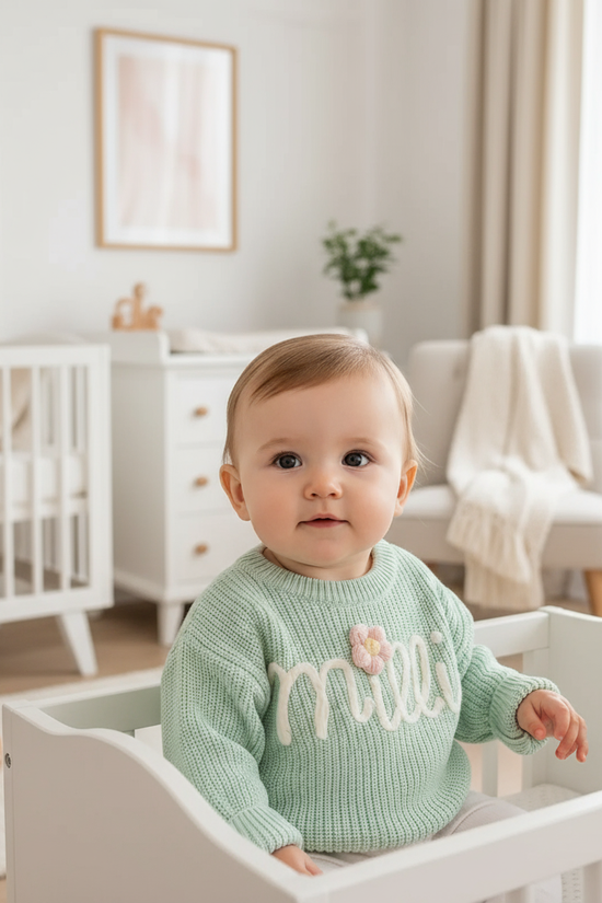 Baby girl in nursery - sitting