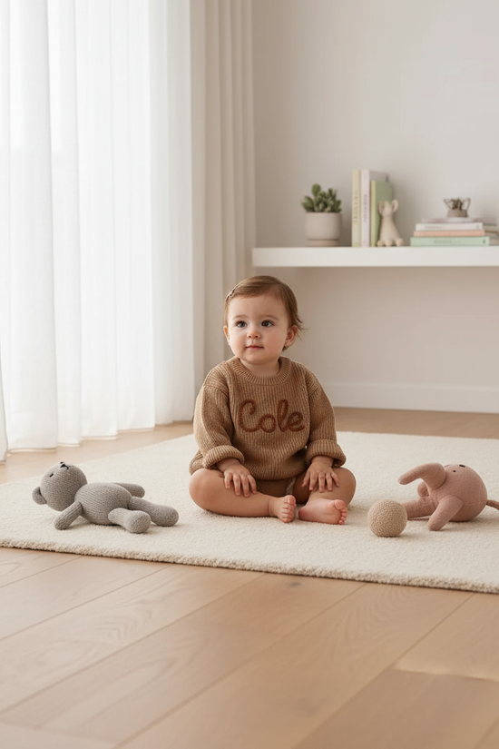 Baby girl in nursery - with toys