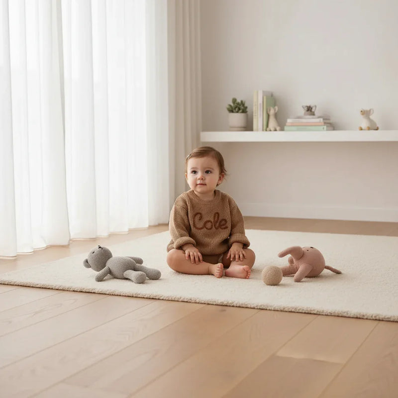 Baby girl in nursery - with toys