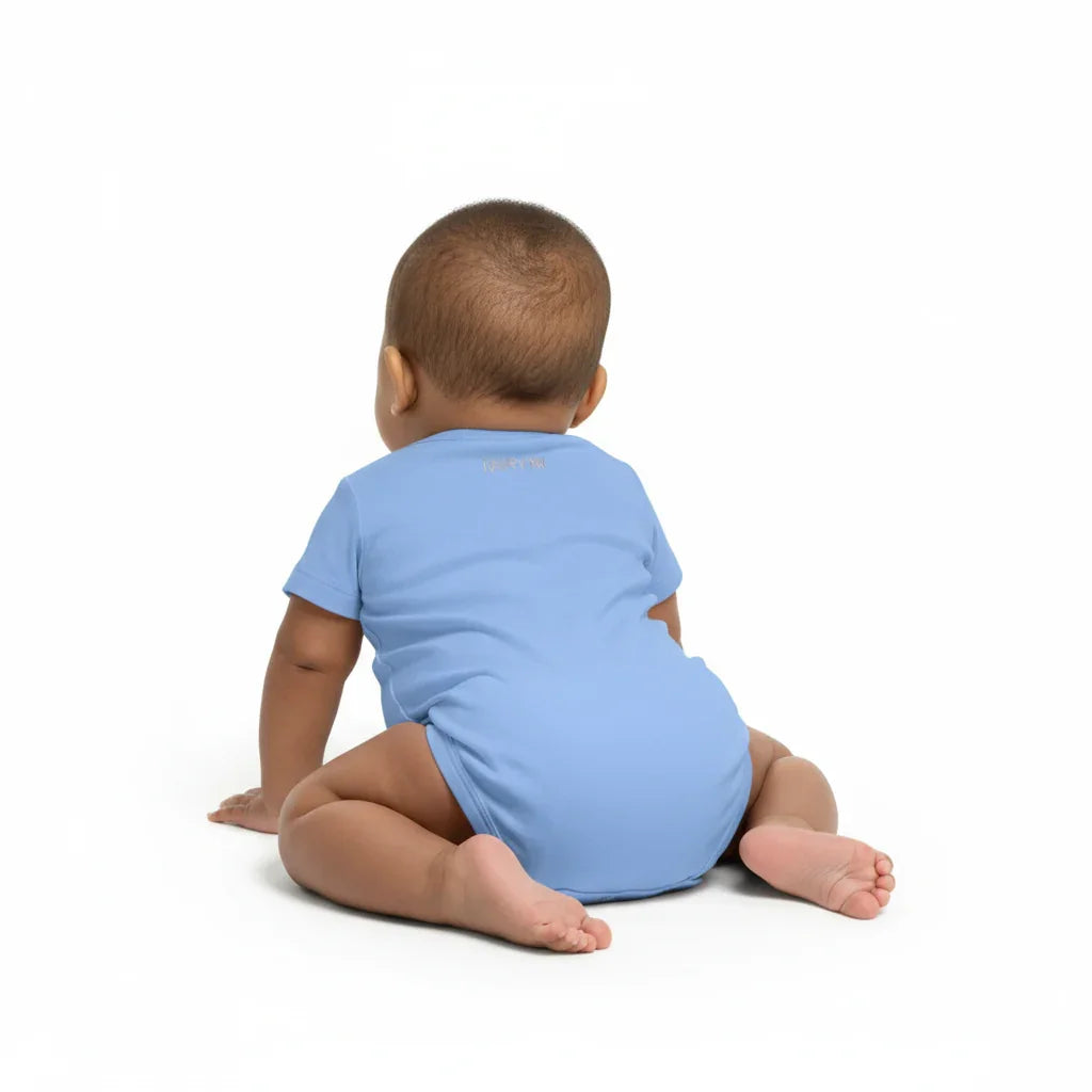 Back view of baby wearing blue IVORYNN onesie