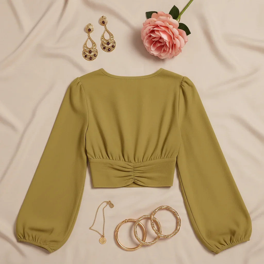 Back view on beige background with vintage gold jewelry and garden rose