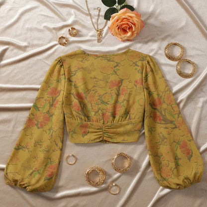 Back view on beige velvet with vintage gold jewelry and apricot rose