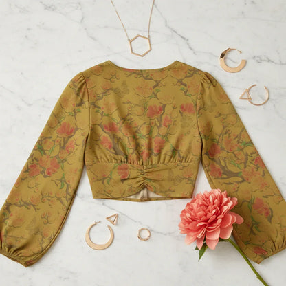 Back view on cream marble with modern geometric jewelry and coral flower