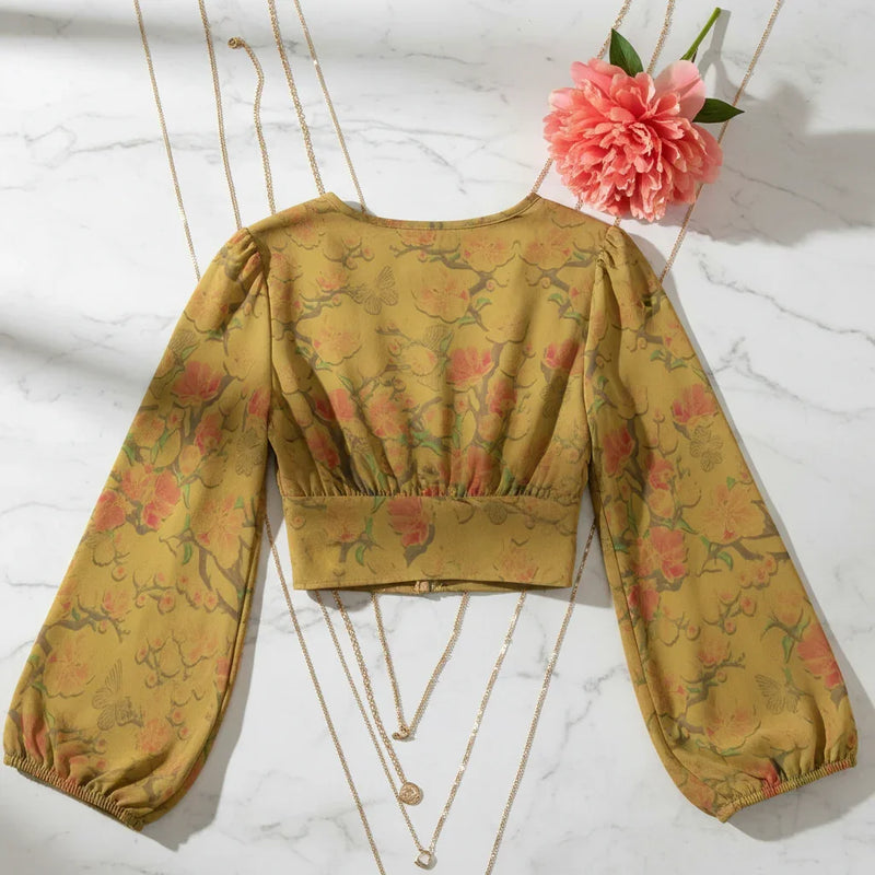 Back view on marble with gold chains and coral peony
