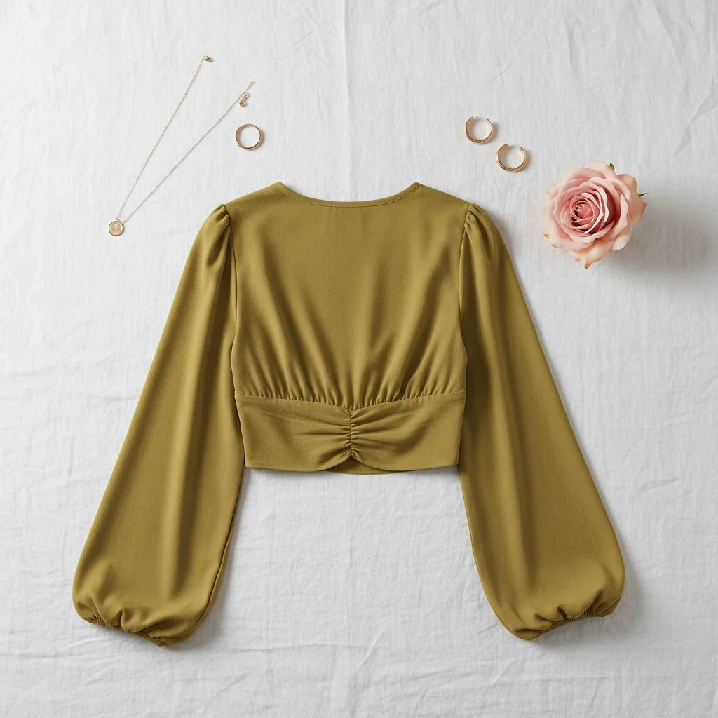 Back view on white linen with minimalist accessories and blush pink rose