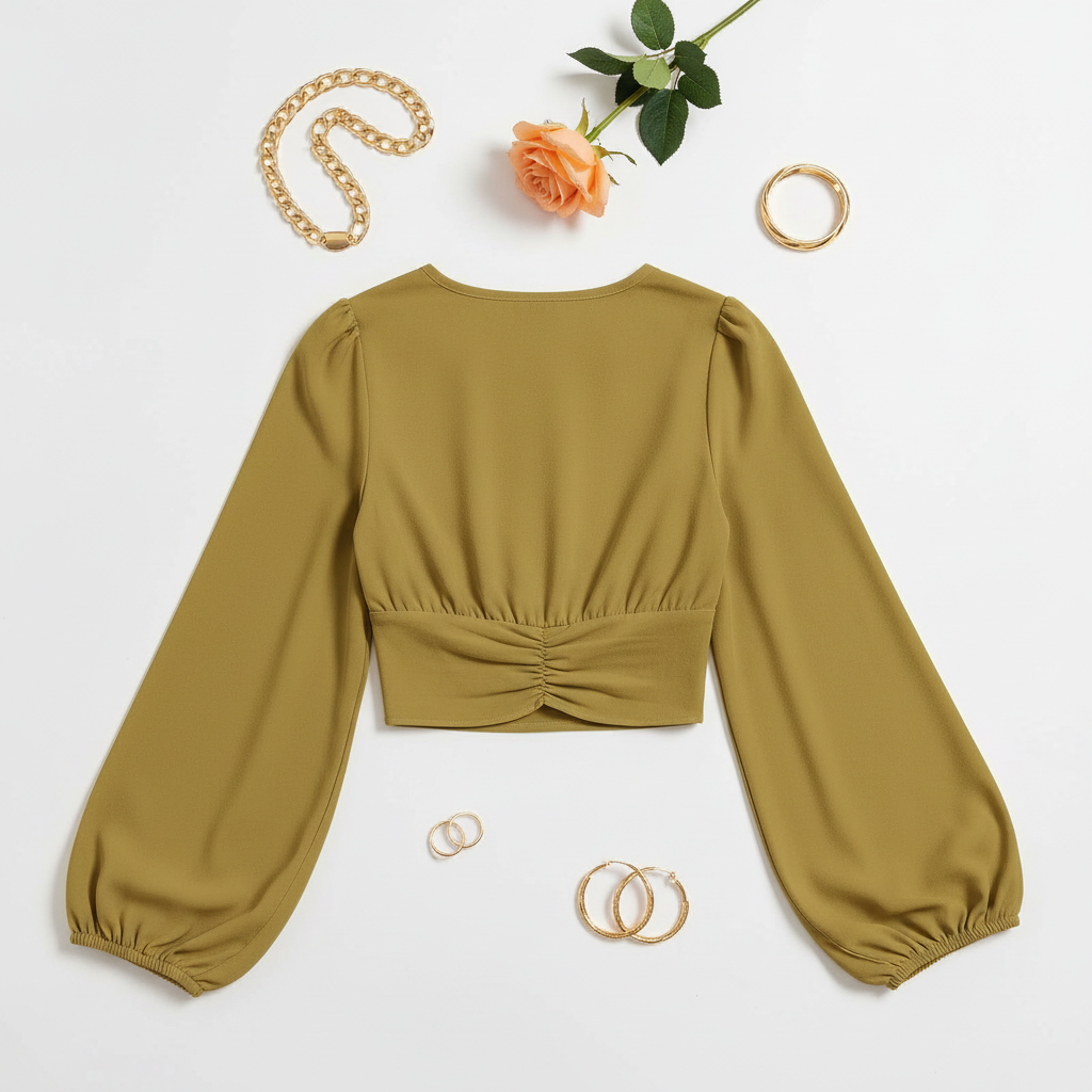 Back view on white surface with gold jewelry and peach rose