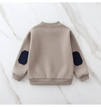 Back view showing collar and cuffs