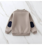 Back view showing collar and cuffs