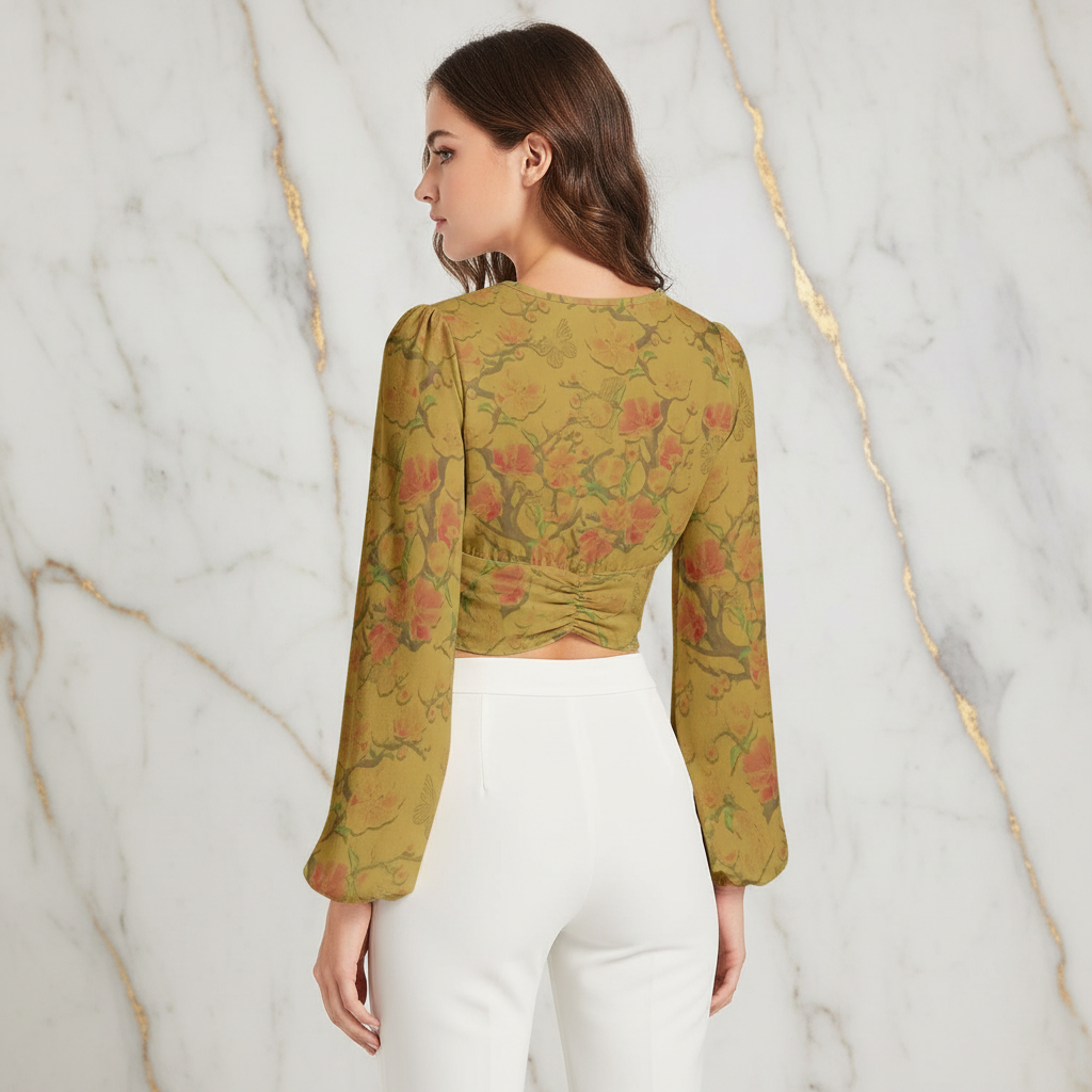 Back view showing ruched detail with white pants