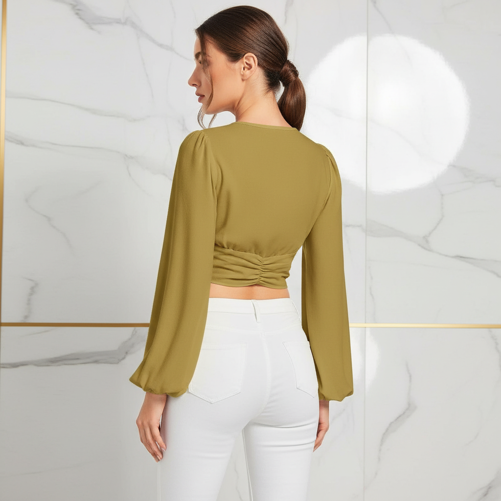 Back view showing ruched detail with white pants